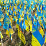 Kyiv, Ukraine, August 2022: – Lots national flags of ukraine wit